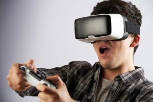 Man playing virtual reality video game with headset and controller