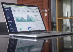 Laptop open on table displaying data